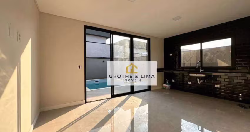 Moderna casa térrea com pé direito duplo e varanda gourmet