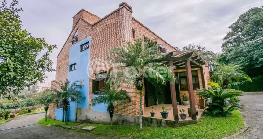 Casa em condomínio fechado com 3 quartos à venda na Avenida Vicente Monteggia, 2212, Cavalhada, Porto Alegre