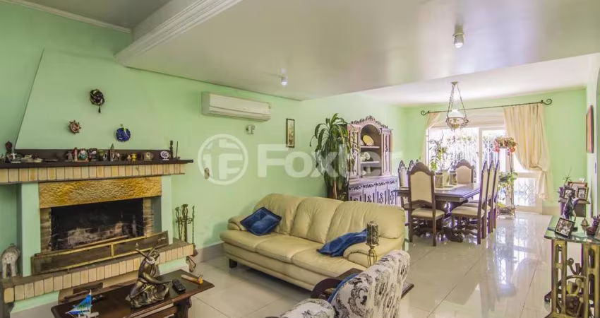 Casa com 4 quartos à venda na Rua Menezes Paredes, 208, Nonoai, Porto Alegre