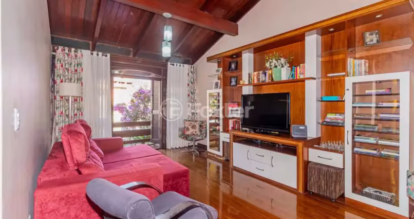 Casa com 4 quartos à venda na Rua Xavier da Cunha, 687, Nonoai, Porto Alegre