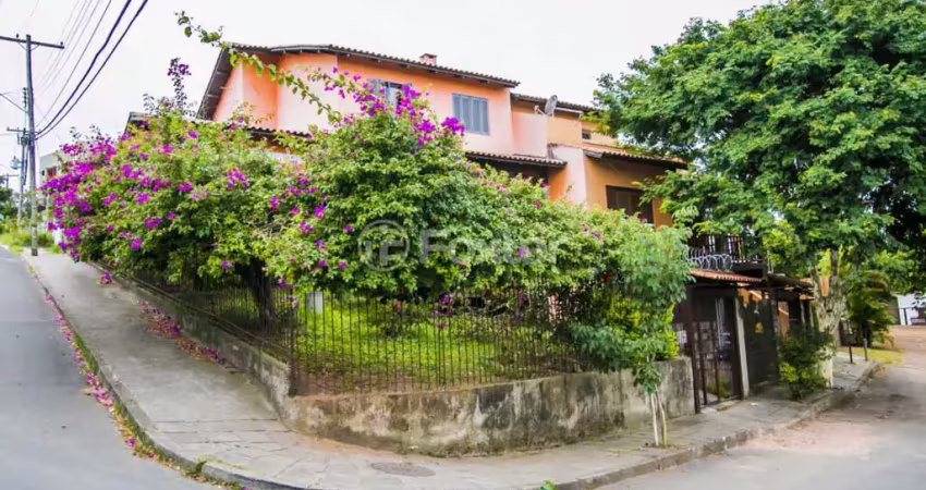 Casa com 5 quartos à venda na Rua Ângelo Passuelo, 79, Vila Nova, Porto Alegre