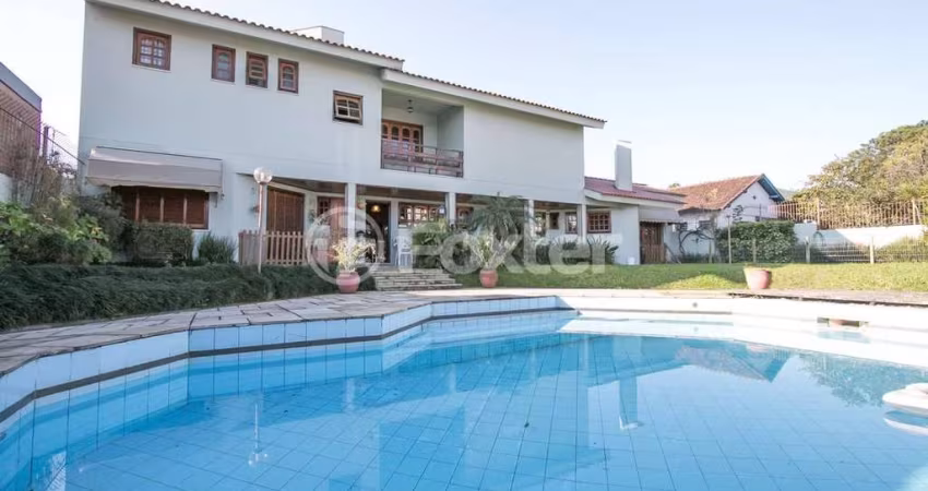Casa com 5 quartos à venda na Rua Caiapó, 15, Vila Assunção, Porto Alegre
