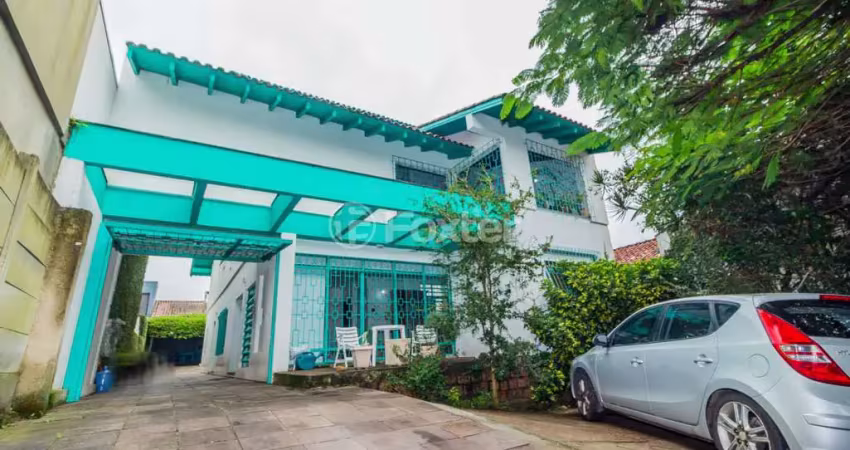 Casa com 5 quartos à venda na Rua Jacundá, 144, Guarujá, Porto Alegre