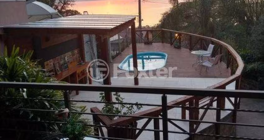Casa com 3 quartos à venda na Rua Charruas, 267, Espírito Santo, Porto Alegre