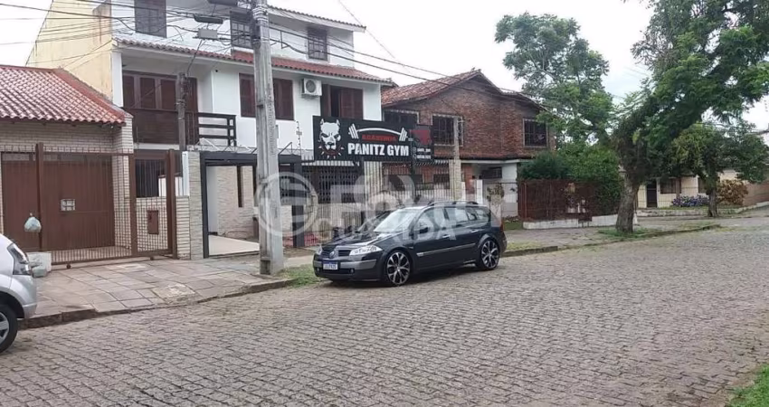 Casa com 3 quartos à venda na Rua Márcio Dias, 360, Nonoai, Porto Alegre