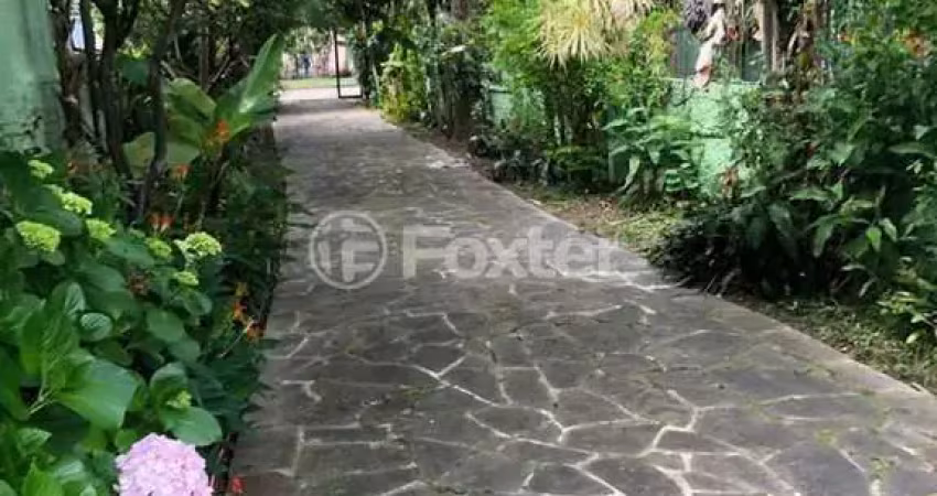 Casa com 3 quartos à venda na Avenida Ararangua, 151, Guarujá, Porto Alegre