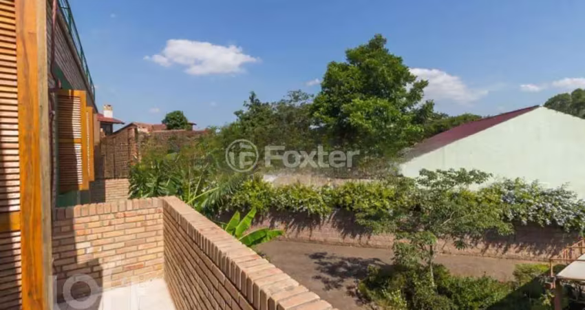 Casa com 3 quartos à venda na Rua Amapá, 919, Vila Nova, Porto Alegre