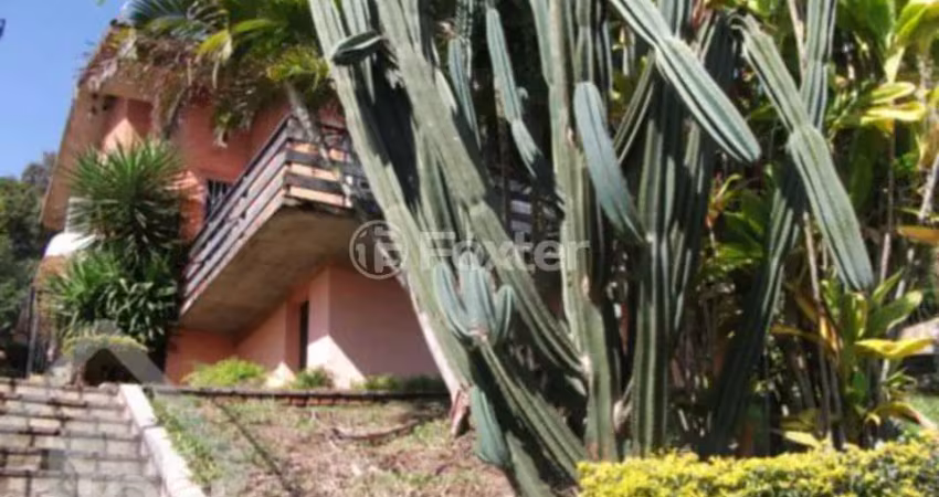 Casa com 4 quartos à venda na Rua Alcebíades Antônio dos Santos, 260, Nonoai, Porto Alegre