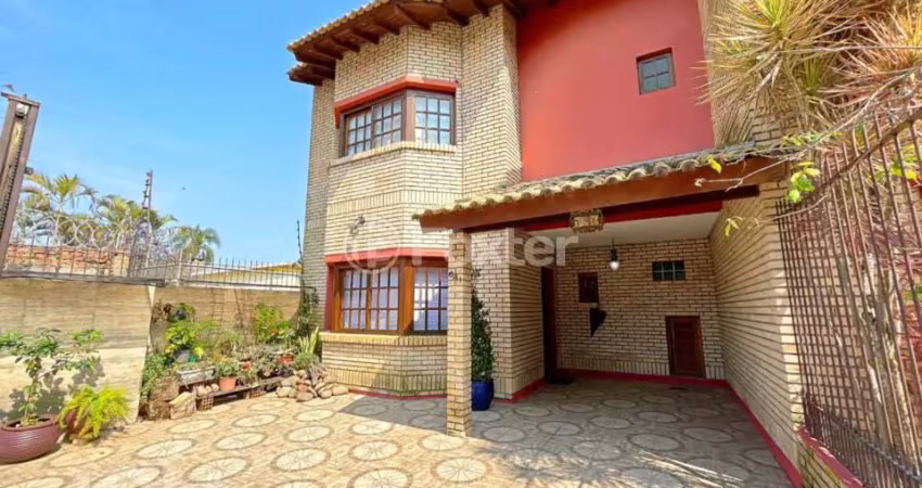Casa com 3 quartos à venda na Rua Jacundá, 641, Guarujá, Porto Alegre