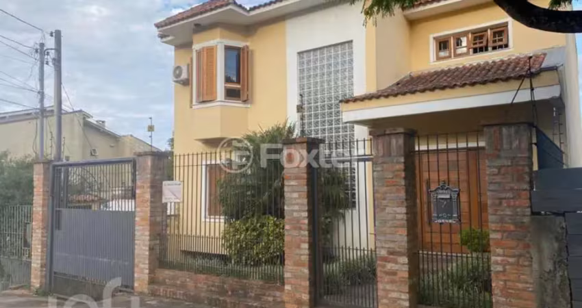 Casa com 3 quartos à venda na Rua Joaquim Cruz, 130, Santo Antônio, Porto Alegre