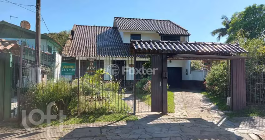 Casa com 3 quartos à venda na Rua Mura, 60, Guarujá, Porto Alegre
