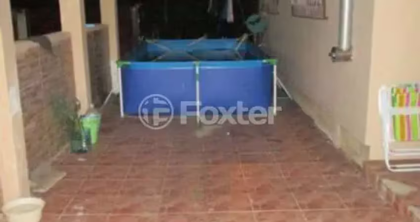 Casa com 4 quartos à venda na Rua Jacundá, 481, Guarujá, Porto Alegre