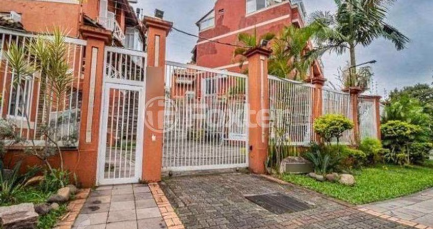Casa em condomínio fechado com 3 quartos à venda na Avenida Guaíba, 4400, Vila Assunção, Porto Alegre