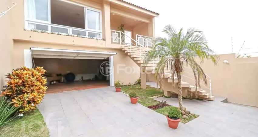 Casa com 3 quartos à venda na Rua Joaquim Cruz, 521, Santo Antônio, Porto Alegre