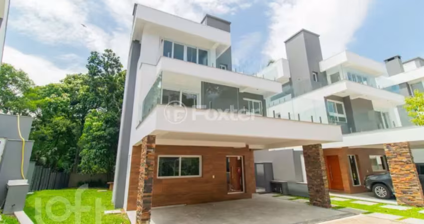 Casa em condomínio fechado com 3 quartos à venda na Avenida Coronel Marcos, 1239, Pedra Redonda, Porto Alegre