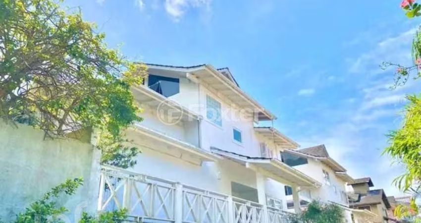 Casa em condomínio fechado com 4 quartos à venda na Rodovia Jornalista Manoel de Menezes, 2057, Barra da Lagoa, Florianópolis