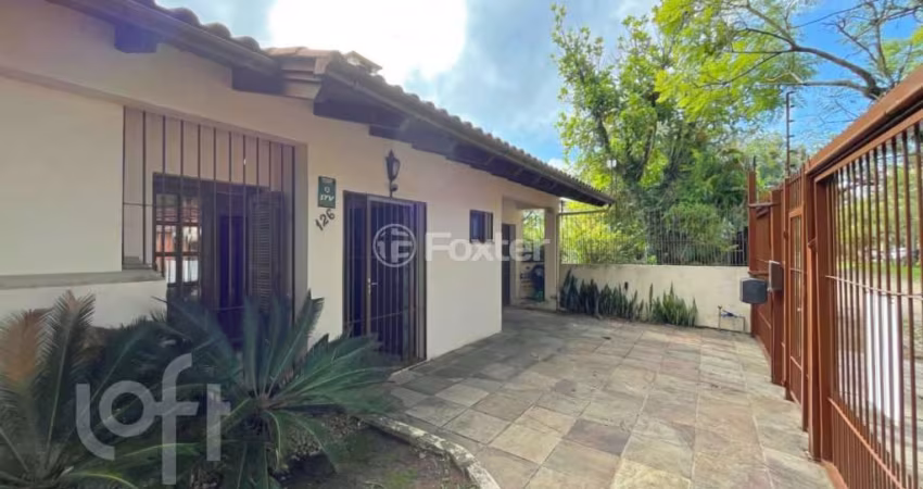 Casa com 3 quartos à venda na Avenida Ararangua, 126, Guarujá, Porto Alegre