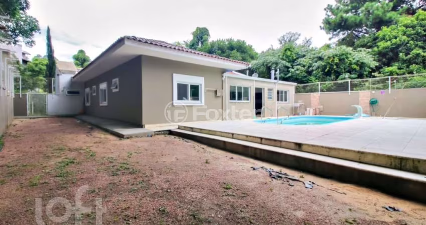 Casa em condomínio fechado com 4 quartos à venda na Rua Professor Bolívar Fontoura, 450, Vila Nova, Porto Alegre