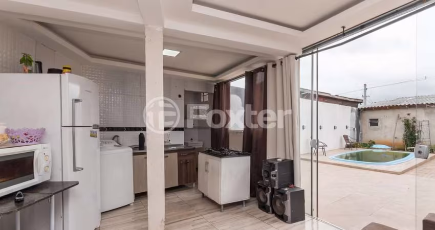 Casa com 2 quartos à venda na Rua Raul Cauduro, 150, Mário Quintana, Porto Alegre
