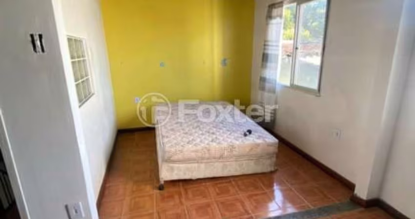 Casa com 5 quartos à venda na Rua Itacurubi, 35, Vila Nova, Porto Alegre