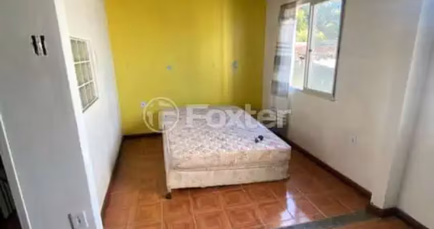 Casa com 5 quartos à venda na Rua Itacurubi, 35, Vila Nova, Porto Alegre