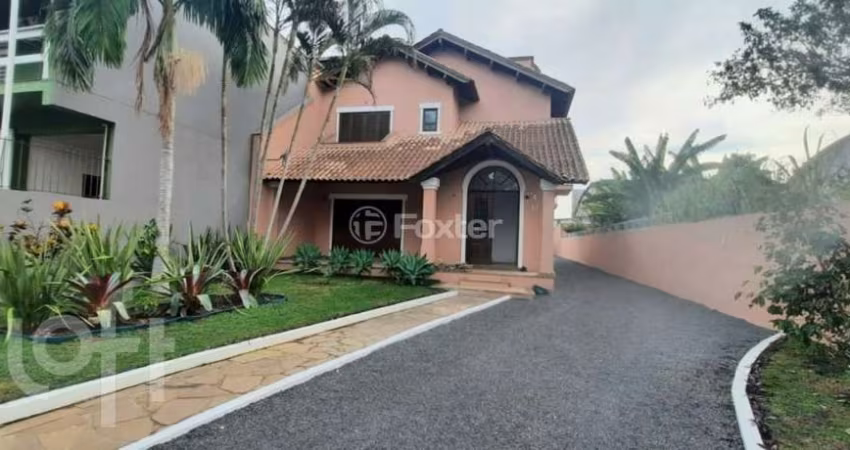 Casa com 5 quartos à venda na Rua Atílio Supertti, 87, Vila Nova, Porto Alegre