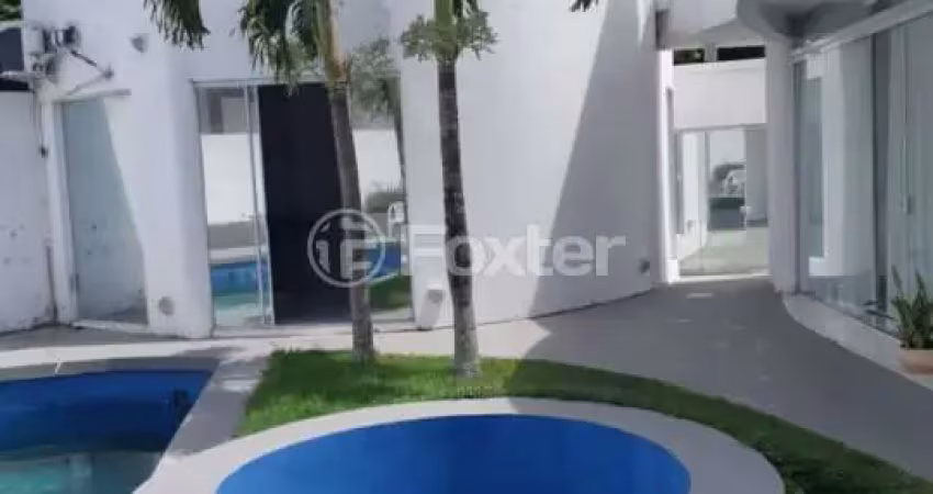 Casa em condomínio fechado com 6 quartos à venda na Rodovia Doutor Antônio Luiz Moura Gonzaga, 135, Rio Tavares, Florianópolis