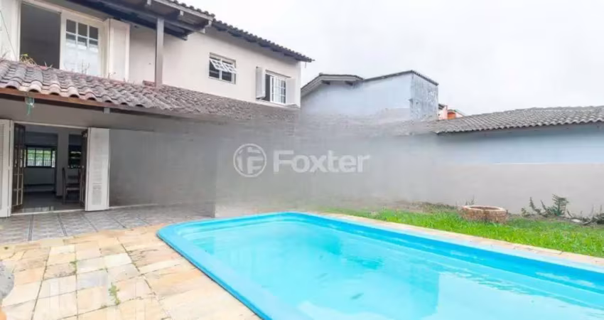 Casa com 4 quartos à venda na Avenida Guaíba, 13166, Guarujá, Porto Alegre