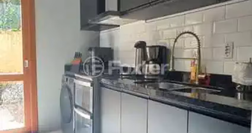 Casa em condomínio fechado com 2 quartos à venda na Rua Octávio de Souza, 929, Teresópolis, Porto Alegre