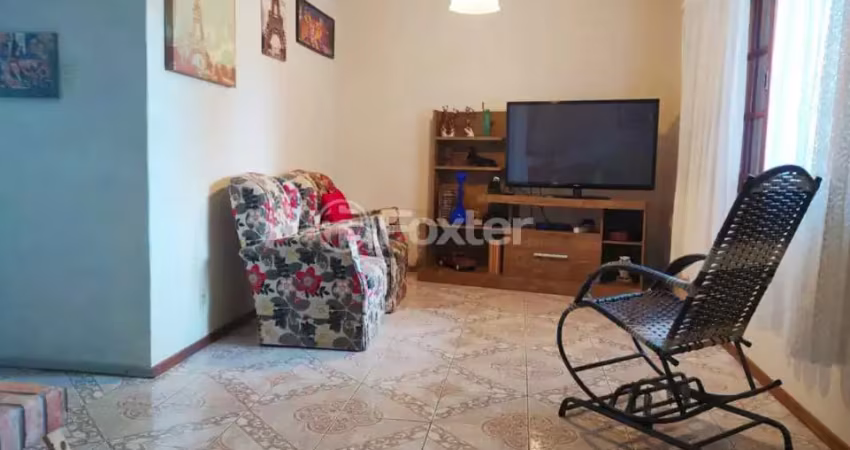Casa com 3 quartos à venda na Rua Cunha Neto, 334, Nonoai, Porto Alegre