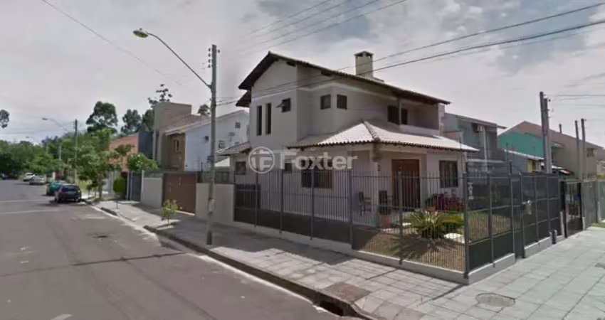Casa com 3 quartos à venda na Rua Heitor Kramer, 421, Guarujá, Porto Alegre
