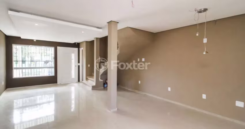 Casa com 3 quartos à venda na Rua Breno Rosa, 30, Vila Nova, Porto Alegre