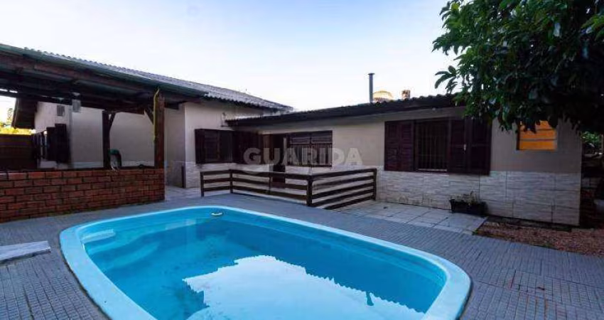 Casa com piscina e 4 dormitórios sendo 2 suítes para alugar no bairro Ipanema.