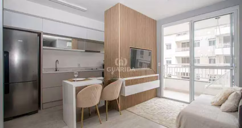 Apartamento mobiliado com 2 dormitórios, sendo 1 suíte, no bairro humaitá com vaga/sacada e churrasqueira interna!