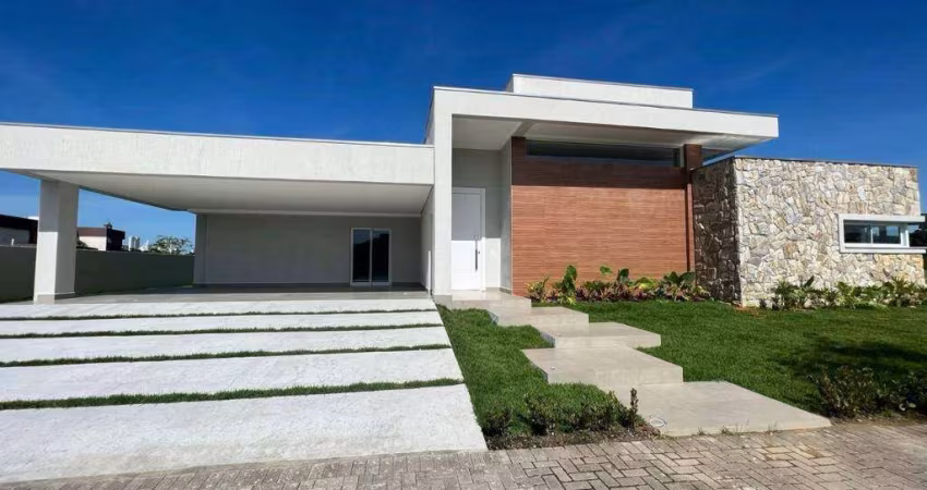 CASA EM CONDOMÍNIO FECHADO - 4 SUÍTES - 4 VAGAS - À 10 MINUTOS DA PRAIA - ÁREA DE LAZER