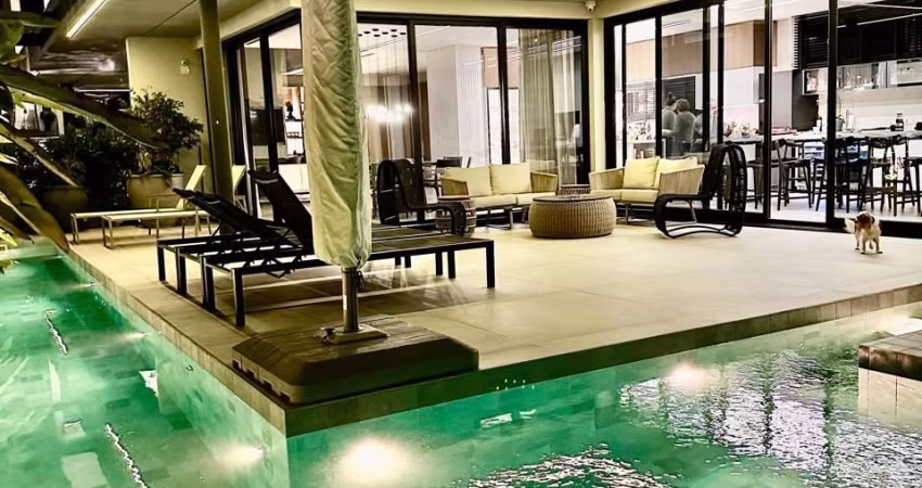 Venha conhecer esta espetacular casa de alto padrão! Com 4 quartos, 4 suítes, 4 banheiros, 4 vagas de garagem e uma área total de 430m2, esta residência é simplesmente deslumbrante.