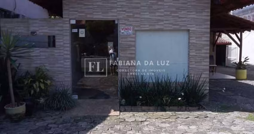 Terreno com 2 casas á venda