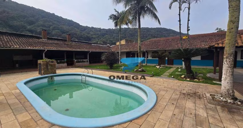 Pousada à venda na praia do Guaiuba no Guarujá I Omega Imoveis