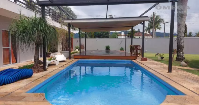 Casa à venda no condomínio jardim acapulco no guarujá | omega imóveis