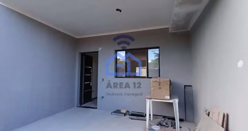 Sobrado geminado em construção à venda no bairro Massaguaçu em Caraguatatuba, SP com 02 suítes, 02
