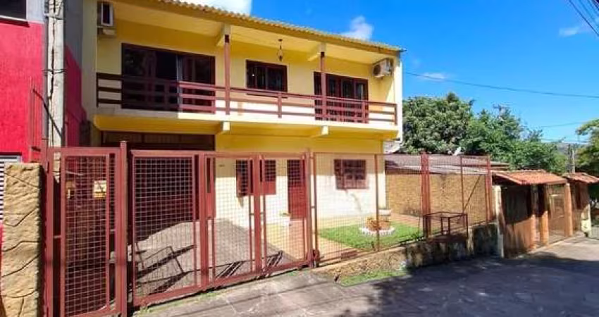 Casa 4 dormitórios à venda Vila Nova Porto Alegre/RS