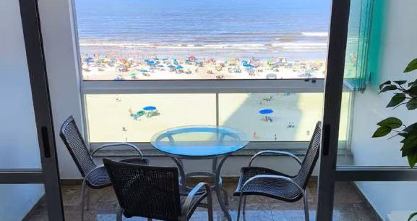 Apartamento mobiliado frente-mar com 1 suíte + 2 dormitórios + dependência e 1 vaga de garagem