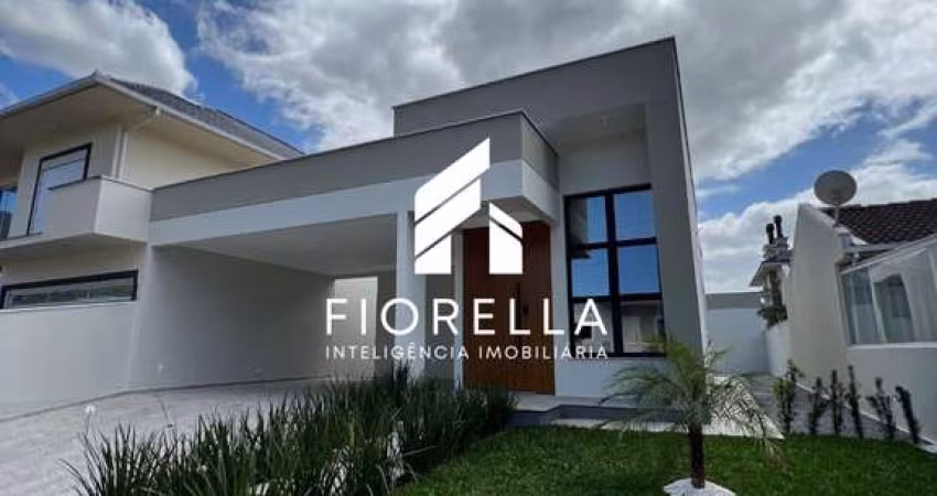 Casa de 03 dormitórios em condomínio fechado, próximo ao mar no Bairro Praia de Fora em Palhoça.-SC.