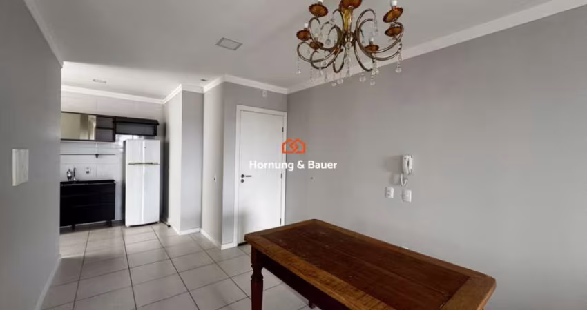 Apartamento semimobiliado com suíte à venda em Torres!