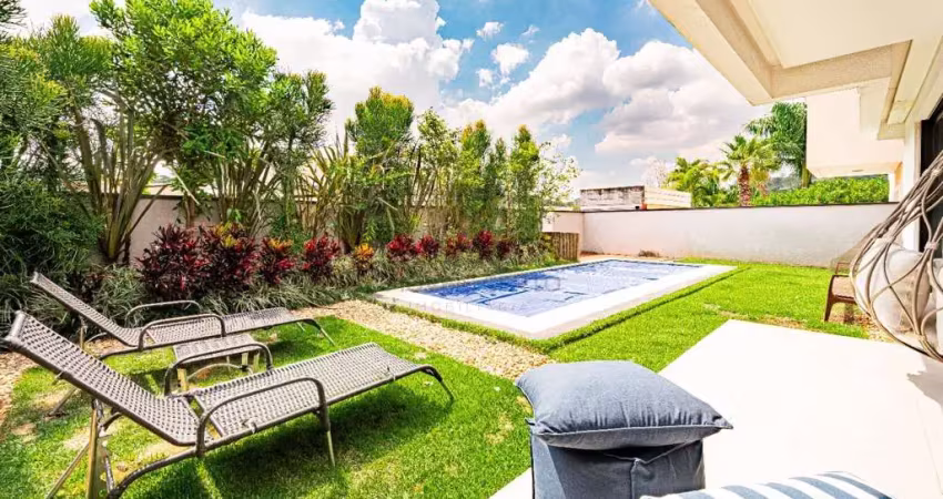 Casa a venda em genesis 1 alphaville com lindo paisagismo, mobiliada, 4 quartos, closet grande e excelentes vagas pra carro