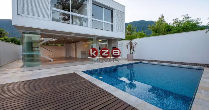 Imóvel de luxo à venda em são sebastião-sp: casa na praia de guaecá com 4 suítes, 3 salas, amplo gourmet e piscina, ao lado do mar.
