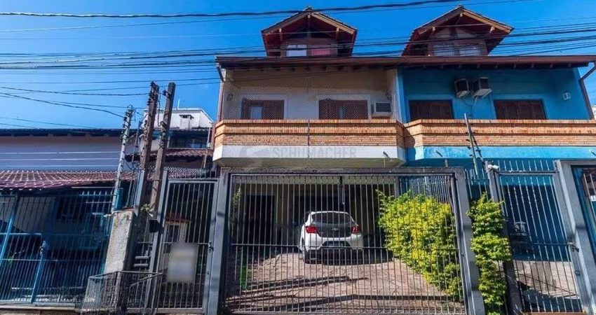Casa 5 dormitórios no bairro Ipanema