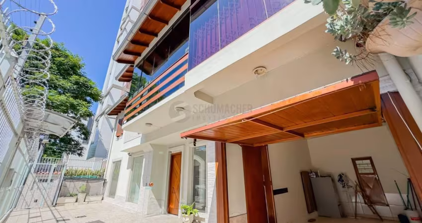 Casa Unifamiliar e Serviço no bairro Menino Deus em Porto Alegre
