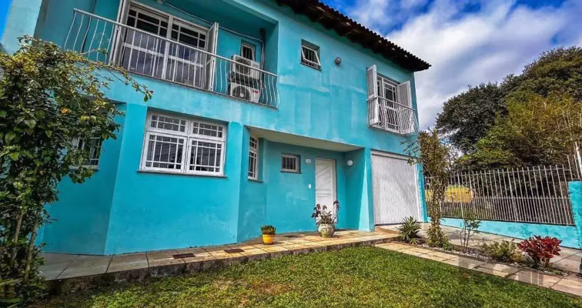 Casa com 4 quartos à venda na Rua Jerolomo Minuzo, 146, Vila Nova, Porto Alegre