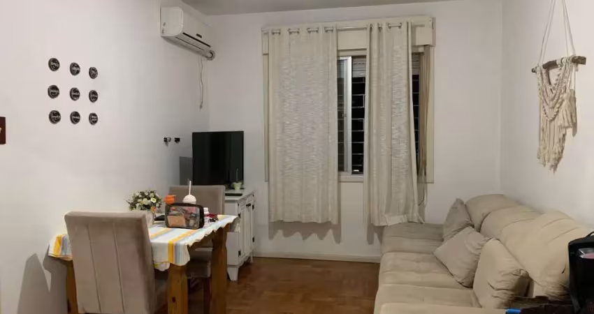 Apartamento de 2 dormitórios, living, cozinha, área de serviço e banheiro social.